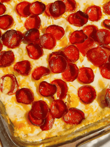 This Dump and Bake Pepperoni Tortellini Alfredo is the ultimate easy dinner recipe for busy families. Cheese-filled tortellini is tossed with creamy Alfredo sauce, Italian seasoning, mozzarella cheese, and crispy pepperoni, then baked until hot and bubbly. If you're looking for simple casserole recipes, easy pasta bake recipes, or family dinner ideas everyone will love, this cheesy tortellini casserole is a must-try. Perfect for weeknight meals, potlucks, and comfort food cravings, this dump and bake pasta recipe requires minimal prep and delivers maximum flavor. Save this pepperoni tortellini Alfredo recipe for an easy baked pasta dinner, cheesy casserole recipe, or quick family meal that will have everyone asking for seconds.
