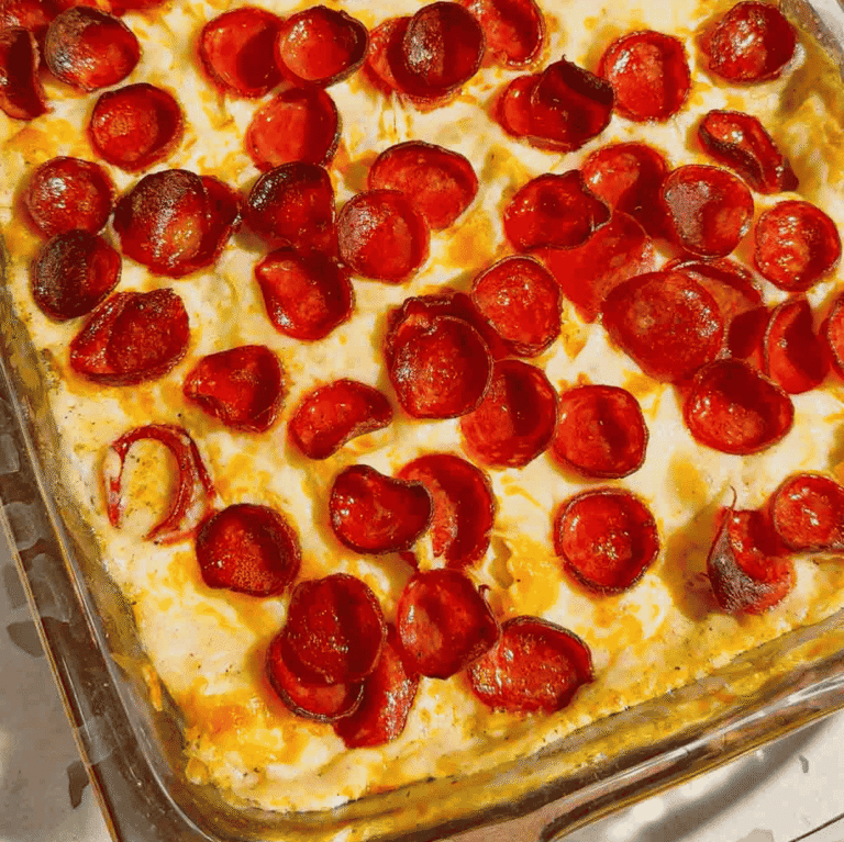This Dump and Bake Pepperoni Tortellini Alfredo is the ultimate easy dinner recipe for busy families. Cheese-filled tortellini is tossed with creamy Alfredo sauce, Italian seasoning, mozzarella cheese, and crispy pepperoni, then baked until hot and bubbly. If you're looking for simple casserole recipes, easy pasta bake recipes, or family dinner ideas everyone will love, this cheesy tortellini casserole is a must-try. Perfect for weeknight meals, potlucks, and comfort food cravings, this dump and bake pasta recipe requires minimal prep and delivers maximum flavor. Save this pepperoni tortellini Alfredo recipe for an easy baked pasta dinner, cheesy casserole recipe, or quick family meal that will have everyone asking for seconds.