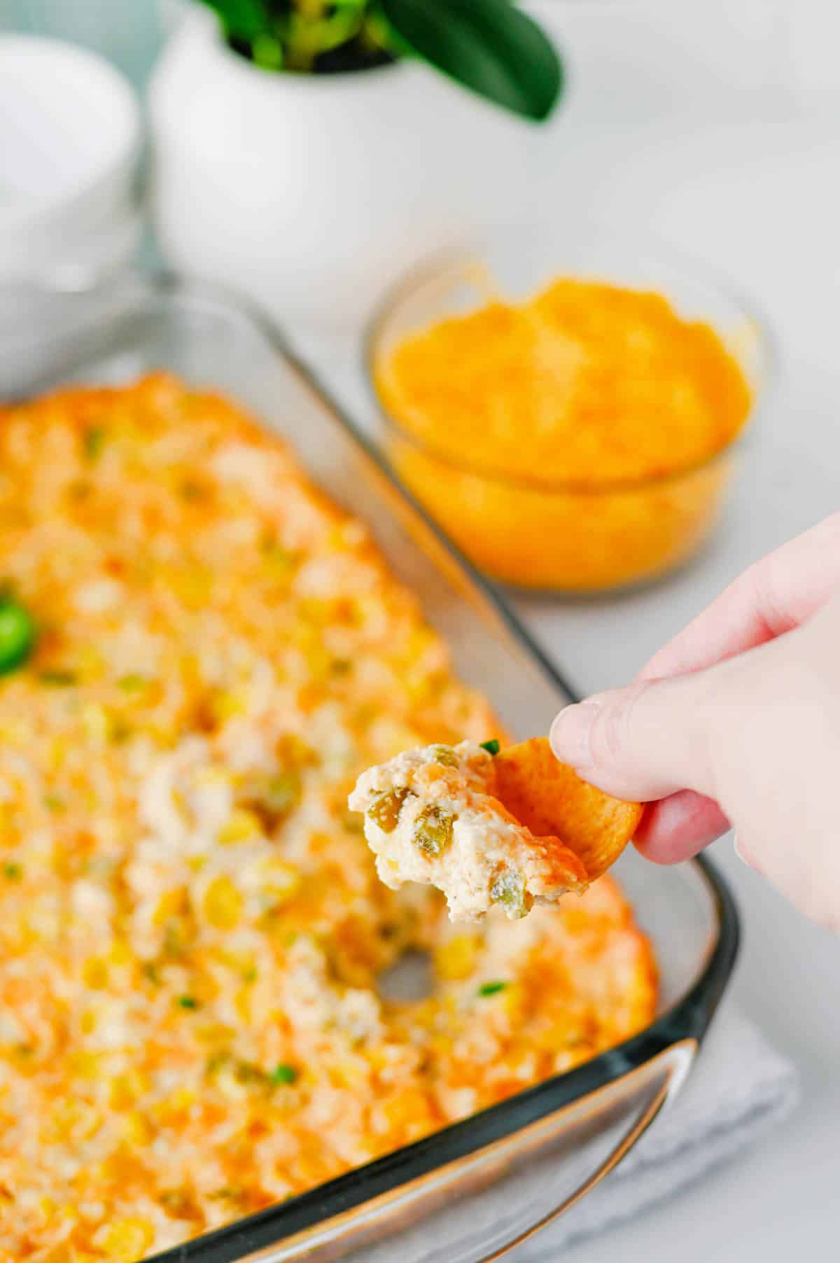 This Jalapeño Corn Dip is the ultimate party appetizer for anyone who loves bold flavor and easy entertaining. Made with sweet corn, cream cheese, sour cream, cheddar cheese, and fresh jalapeños, this creamy baked corn dip is hot, cheesy, and packed with just the right amount of heat. Whether you're searching for easy dip recipes, hot corn dip ideas, game day appetizers, party dips for a crowd, cheesy jalapeno dip recipes, or baked appetizer recipes, this one checks all the boxes. Perfect for potlucks, tailgates, holiday gatherings, BBQs, and family get-togethers, this spicy corn dip pairs perfectly with tortilla chips, crackers, or fresh veggies. Save this easy corn dip recipe for your next party and watch it disappear fast. It's a crowd-pleasing appetizer everyone will be asking for again and again.