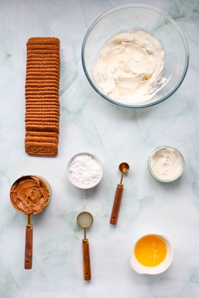 no bake biscoff cheesecake ingredients on a kitchen counter