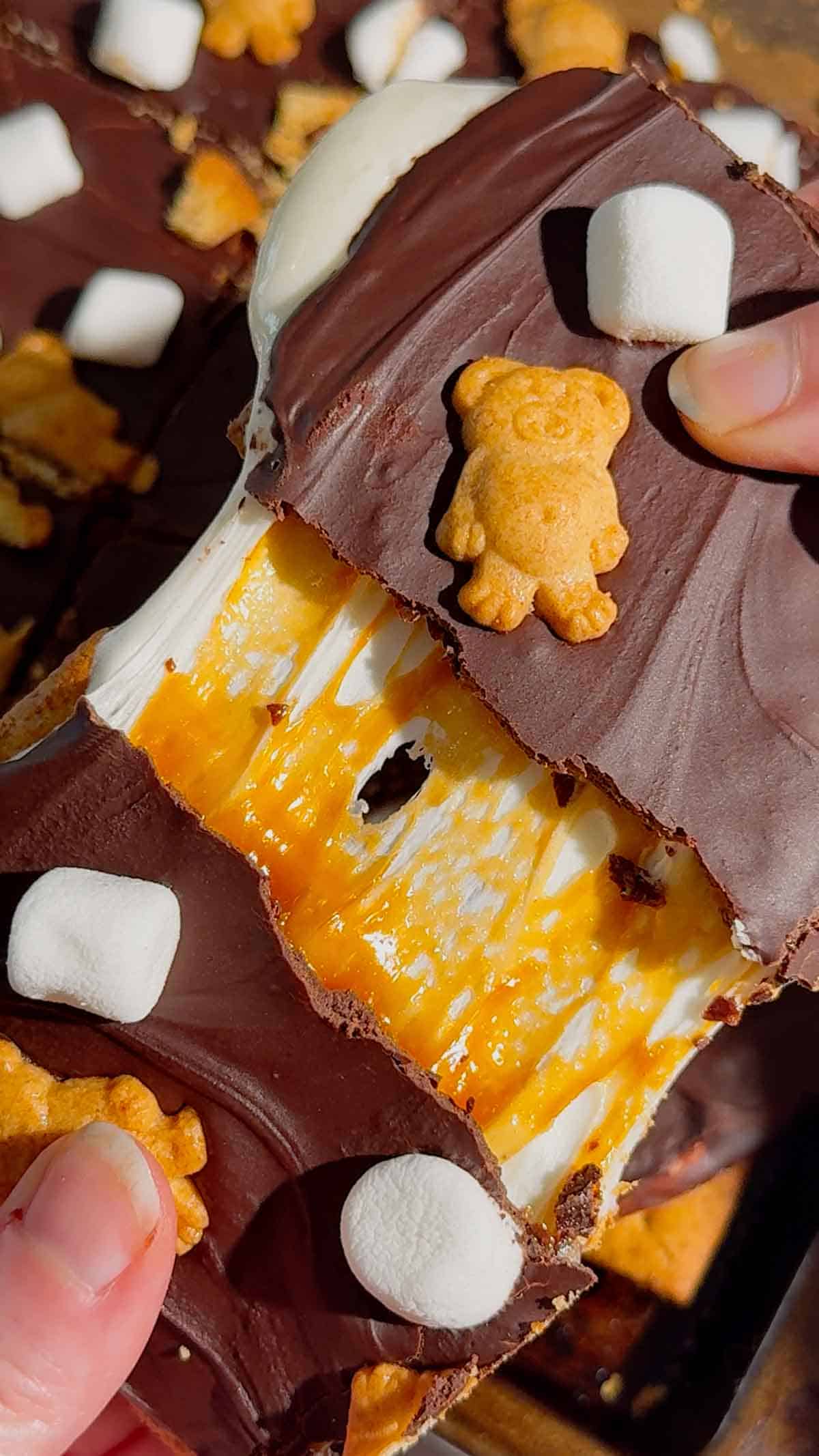 These No Bake Caramel S’mores Bars are the perfect easy dessert for summer parties, backyard BBQs, potlucks, family gatherings, and holiday celebrations. Made with layers of graham crackers, gooey marshmallow, creamy dulce de leche caramel, and rich melted chocolate, these no bake dessert bars deliver all the flavors of a classic campfire treat without turning on the oven. If you love easy no bake recipes, s’mores dessert bars, marshmallow desserts, chocolate caramel treats, and simple make ahead desserts, this recipe is a must-try. These chilled bars are sweet, chewy, crunchy, and packed with irresistible flavor, making them one of the best easy dessert recipes for feeding a crowd. Save this easy no bake s’mores recipe for your next party dessert table or summer dessert spread.