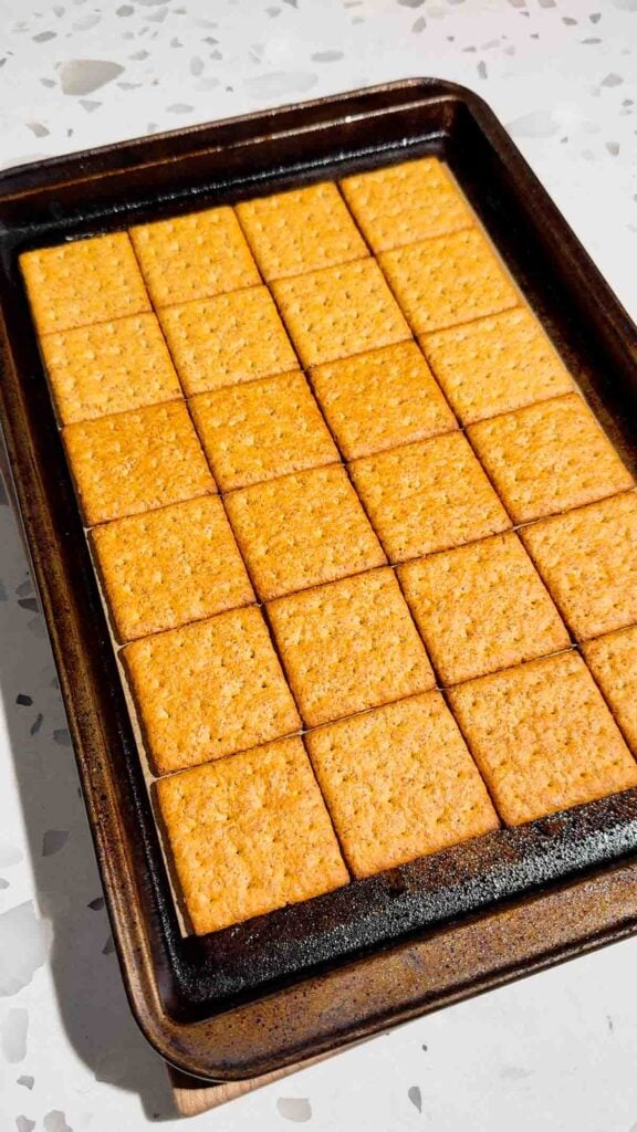 graham crackers on a parchment lined baking sheet
