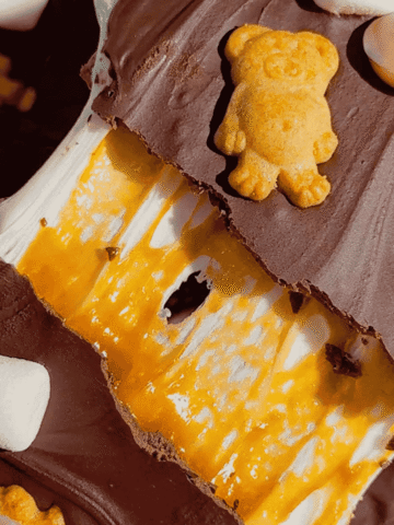 These No Bake Caramel S’mores Bars are the perfect easy dessert for summer parties, backyard BBQs, potlucks, family gatherings, and holiday celebrations. Made with layers of graham crackers, gooey marshmallow, creamy dulce de leche caramel, and rich melted chocolate, these no bake dessert bars deliver all the flavors of a classic campfire treat without turning on the oven. If you love easy no bake recipes, s’mores dessert bars, marshmallow desserts, chocolate caramel treats, and simple make ahead desserts, this recipe is a must-try. These chilled bars are sweet, chewy, crunchy, and packed with irresistible flavor, making them one of the best easy dessert recipes for feeding a crowd. Save this easy no bake s’mores recipe for your next party dessert table or summer dessert spread.