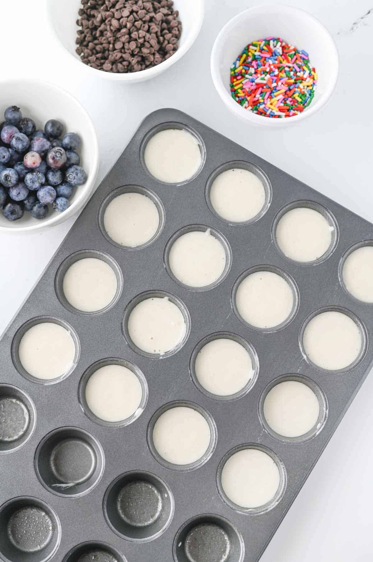 pancake batter in mini muffin tins