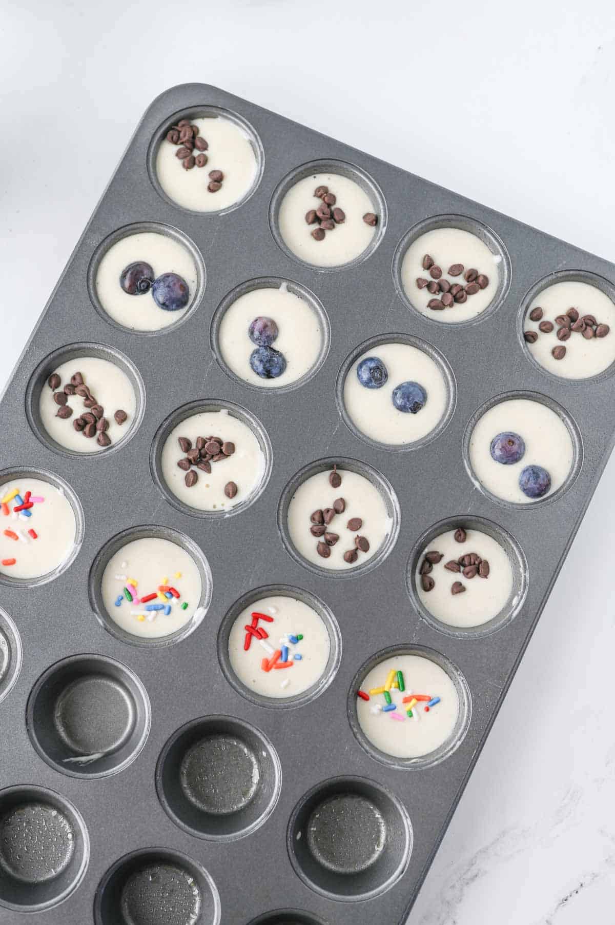 toppings added to pancake batter in mini muffin tins