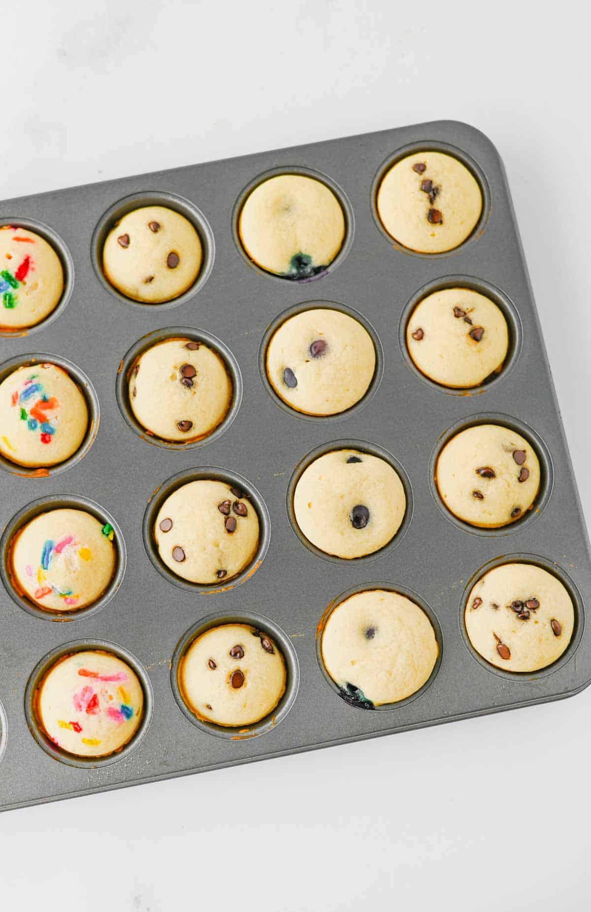 Looking for a fun, kid-friendly breakfast that's quick, easy, and perfect for busy mornings? These Pancake Bites are the answer! Made with simple pancake mix and customizable with your favorite add-ins like mini chocolate chips, blueberries, sprinkles, or fruit, these mini muffins bake up soft, fluffy, and delicious in just 10 minutes. They're great for meal prep, lunch boxes, after-school snacks, brunch spreads, and grab-and-go breakfasts. If you love easy breakfast recipes, mini pancake muffins, bite-sized treats, and family-friendly recipes, you'll want to save this one. These homemade Pancake Bites are freezer-friendly, customizable, and a fun way to make breakfast exciting for kids and adults alike. Save this easy pancake recipe for later!