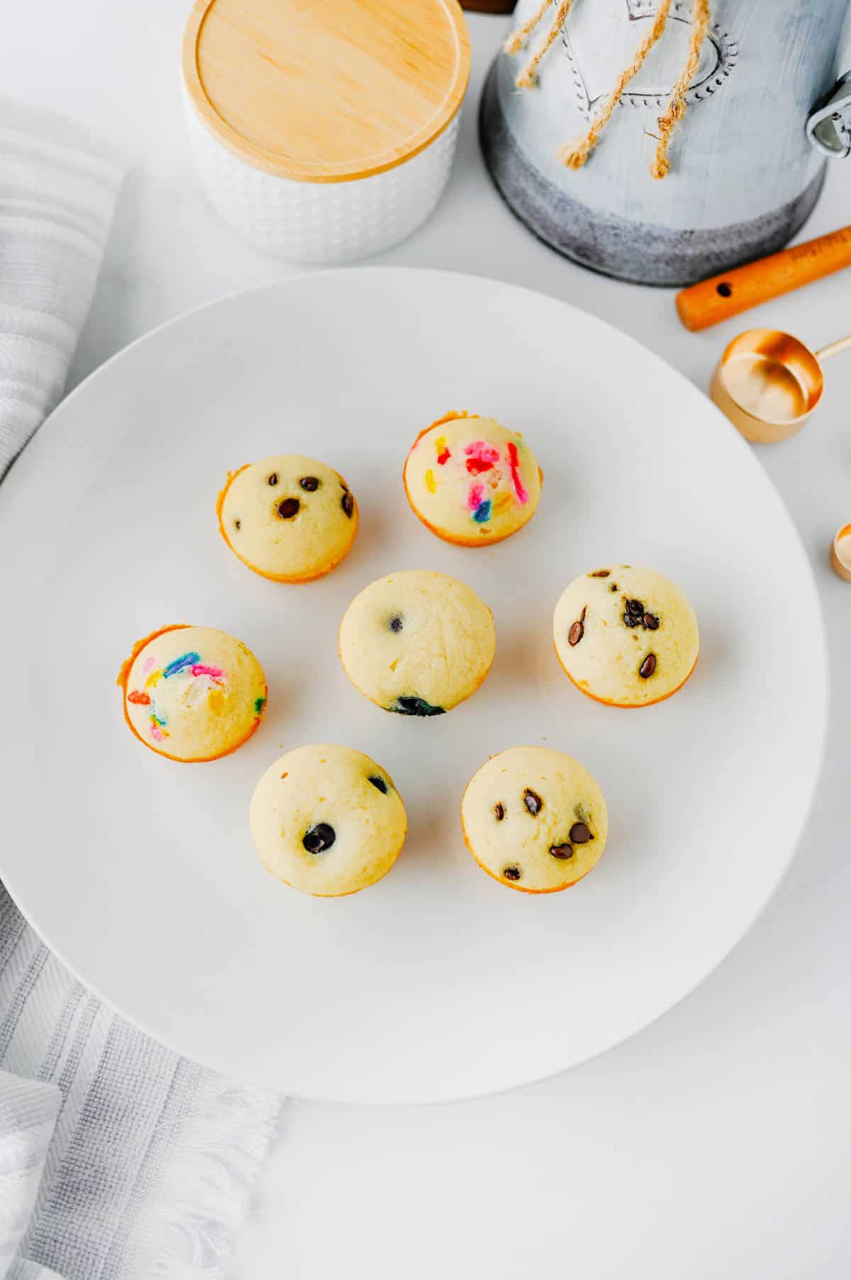 Looking for a fun, kid-friendly breakfast that's quick, easy, and perfect for busy mornings? These Pancake Bites are the answer! Made with simple pancake mix and customizable with your favorite add-ins like mini chocolate chips, blueberries, sprinkles, or fruit, these mini muffins bake up soft, fluffy, and delicious in just 10 minutes. They're great for meal prep, lunch boxes, after-school snacks, brunch spreads, and grab-and-go breakfasts. If you love easy breakfast recipes, mini pancake muffins, bite-sized treats, and family-friendly recipes, you'll want to save this one. These homemade Pancake Bites are freezer-friendly, customizable, and a fun way to make breakfast exciting for kids and adults alike. Save this easy pancake recipe for later!