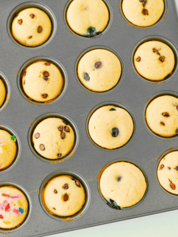 Looking for a fun, kid-friendly breakfast that's quick, easy, and perfect for busy mornings? These Pancake Bites are the answer! Made with simple pancake mix and customizable with your favorite add-ins like mini chocolate chips, blueberries, sprinkles, or fruit, these mini muffins bake up soft, fluffy, and delicious in just 10 minutes. They're great for meal prep, lunch boxes, after-school snacks, brunch spreads, and grab-and-go breakfasts. If you love easy breakfast recipes, mini pancake muffins, bite-sized treats, and family-friendly recipes, you'll want to save this one. These homemade Pancake Bites are freezer-friendly, customizable, and a fun way to make breakfast exciting for kids and adults alike. Save this easy pancake recipe for later!