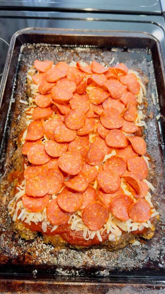 pepperoni slices on top of sheet pan meatloaf