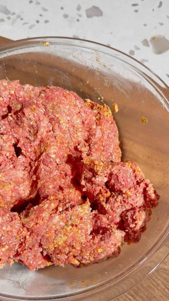fully mixed meatloaf mixture in a mixing bowl