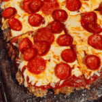 Looking for easy meatloaf recipes with a fun pizza twist? This Sheet Pan Pizza Meatloaf is loaded with all the flavors your family loves and is perfect for busy weeknights. Made with seasoned ground beef, pizza sauce, mozzarella cheese, and pepperoni, this Pizza Meatloaf Recipe is a great option for Family Dinner Ideas, Ground Beef Dinner Recipes, and Easy Weeknight Dinners. The sheet pan method helps it cook quickly while creating plenty of crispy edges in every bite. If you love Pizza Inspired Recipes, Meatloaf Recipes Easy, Sheet Pan Dinners, Comfort Food Recipes, and Kid Friendly Dinner Ideas, this cheesy meatloaf is sure to become a new favorite. Perfect for meal prep, family meals, potlucks, and simple dinners everyone will happily eat.