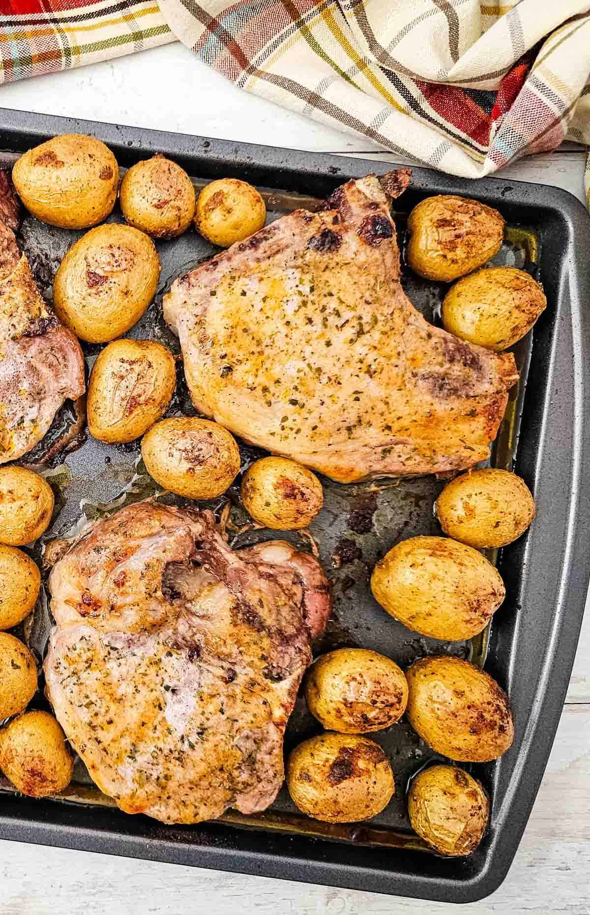 Looking for an easy Sheet Pan Dinner the whole family will love? These Sheet Pan Ranch Pork Chops and Potatoes are packed with flavor and perfect for busy weeknights. Juicy Pork Chops Recipes meet crispy roasted potatoes in this simple One Pan Meal that requires minimal prep and cleanup. If you're searching for Easy Pork Chop Recipes, Pork Chop Dinner Ideas, Sheet Pan Meals, Ranch Pork Chops, Oven Baked Pork Chops, or Quick Family Dinners, this recipe is a must-try. Made with tender pork chops, baby potatoes, ranch seasoning, and simple pantry spices, it's one of the best Easy Dinner Recipes for hectic evenings. Save this Pork And Potatoes Dinner for your collection of Weeknight Dinner Recipes, Comfort Food Recipes, Family Meals, and Easy Sheet Pan Recipes.