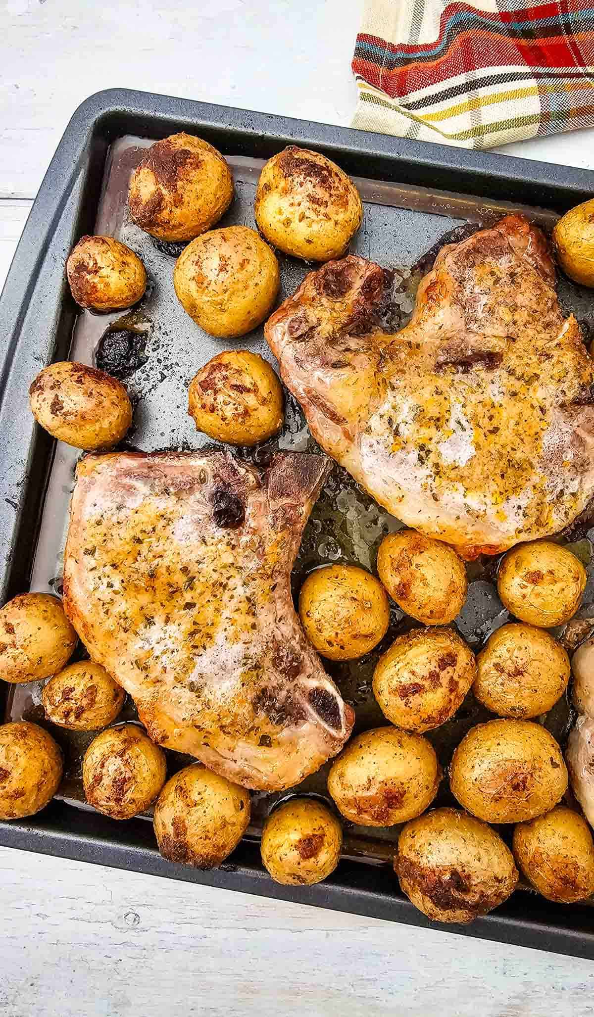 Looking for an easy Sheet Pan Dinner the whole family will love? These Sheet Pan Ranch Pork Chops and Potatoes are packed with flavor and perfect for busy weeknights. Juicy Pork Chops Recipes meet crispy roasted potatoes in this simple One Pan Meal that requires minimal prep and cleanup. If you're searching for Easy Pork Chop Recipes, Pork Chop Dinner Ideas, Sheet Pan Meals, Ranch Pork Chops, Oven Baked Pork Chops, or Quick Family Dinners, this recipe is a must-try. Made with tender pork chops, baby potatoes, ranch seasoning, and simple pantry spices, it's one of the best Easy Dinner Recipes for hectic evenings. Save this Pork And Potatoes Dinner for your collection of Weeknight Dinner Recipes, Comfort Food Recipes, Family Meals, and Easy Sheet Pan Recipes.