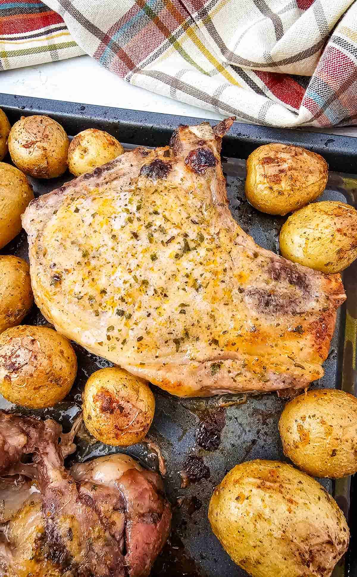 Looking for an easy Sheet Pan Dinner the whole family will love? These Sheet Pan Ranch Pork Chops and Potatoes are packed with flavor and perfect for busy weeknights. Juicy Pork Chops Recipes meet crispy roasted potatoes in this simple One Pan Meal that requires minimal prep and cleanup. If you're searching for Easy Pork Chop Recipes, Pork Chop Dinner Ideas, Sheet Pan Meals, Ranch Pork Chops, Oven Baked Pork Chops, or Quick Family Dinners, this recipe is a must-try. Made with tender pork chops, baby potatoes, ranch seasoning, and simple pantry spices, it's one of the best Easy Dinner Recipes for hectic evenings. Save this Pork And Potatoes Dinner for your collection of Weeknight Dinner Recipes, Comfort Food Recipes, Family Meals, and Easy Sheet Pan Recipes.