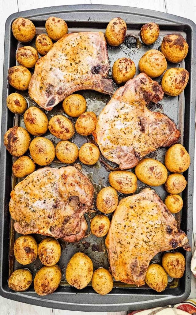 Looking for an easy Sheet Pan Dinner the whole family will love? These Sheet Pan Ranch Pork Chops and Potatoes are packed with flavor and perfect for busy weeknights. Juicy Pork Chops Recipes meet crispy roasted potatoes in this simple One Pan Meal that requires minimal prep and cleanup. If you're searching for Easy Pork Chop Recipes, Pork Chop Dinner Ideas, Sheet Pan Meals, Ranch Pork Chops, Oven Baked Pork Chops, or Quick Family Dinners, this recipe is a must-try. Made with tender pork chops, baby potatoes, ranch seasoning, and simple pantry spices, it's one of the best Easy Dinner Recipes for hectic evenings. Save this Pork And Potatoes Dinner for your collection of Weeknight Dinner Recipes, Comfort Food Recipes, Family Meals, and Easy Sheet Pan Recipes.