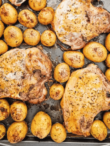 Looking for an easy Sheet Pan Dinner the whole family will love? These Sheet Pan Ranch Pork Chops and Potatoes are packed with flavor and perfect for busy weeknights. Juicy Pork Chops Recipes meet crispy roasted potatoes in this simple One Pan Meal that requires minimal prep and cleanup. If you're searching for Easy Pork Chop Recipes, Pork Chop Dinner Ideas, Sheet Pan Meals, Ranch Pork Chops, Oven Baked Pork Chops, or Quick Family Dinners, this recipe is a must-try. Made with tender pork chops, baby potatoes, ranch seasoning, and simple pantry spices, it's one of the best Easy Dinner Recipes for hectic evenings. Save this Pork And Potatoes Dinner for your collection of Weeknight Dinner Recipes, Comfort Food Recipes, Family Meals, and Easy Sheet Pan Recipes.