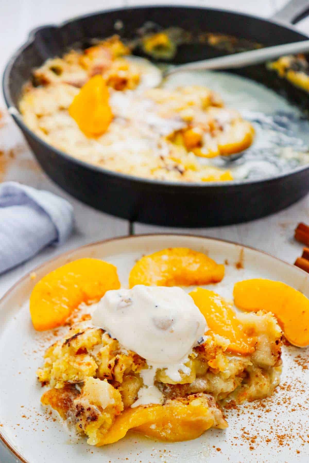 This Skillet Peach Dump Cake is the ultimate easy dessert recipe for peach lovers. Made with canned peaches or fresh peaches, yellow cake mix, butter, and cinnamon, this Peach Dump Cake Recipe comes together with minimal prep and bakes to golden perfection in a cast iron skillet. If you're searching for Easy Peach Desserts, Peach Dessert Recipes, Dump Cake Recipes, Peach Cobbler Dump Cake, Cast Iron Skillet Desserts, Summer Peach Recipes, Fresh Peach Desserts, or Quick Family Desserts, this recipe is a must-try. Perfect for potlucks, BBQs, holidays, weeknight treats, and summer gatherings, this warm and buttery dessert tastes amazing topped with vanilla ice cream or whipped cream. Save this Easy Peach Dump Cake for your next simple homemade dessert.
