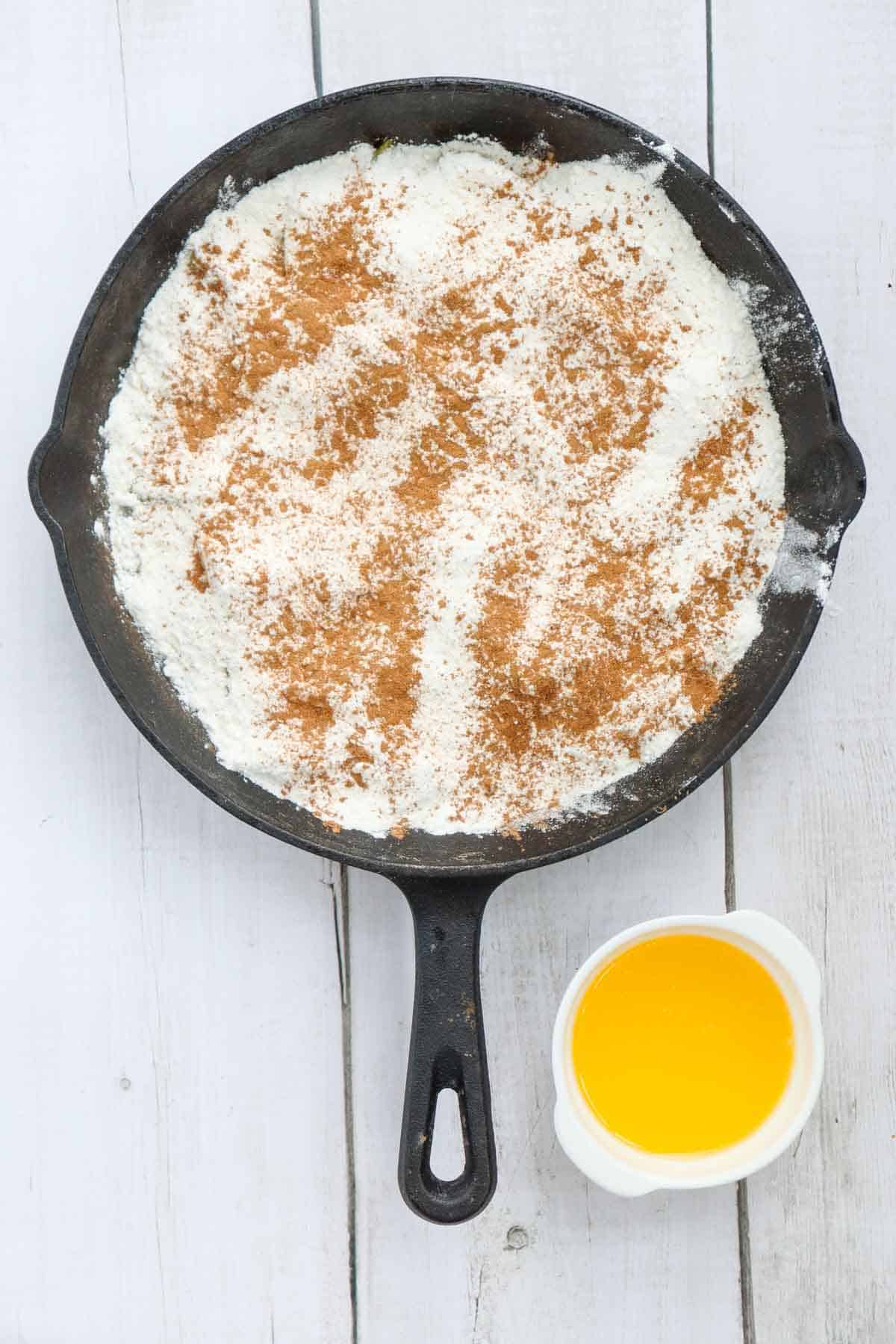 ground cinnamon sprinkled over the cake mix
