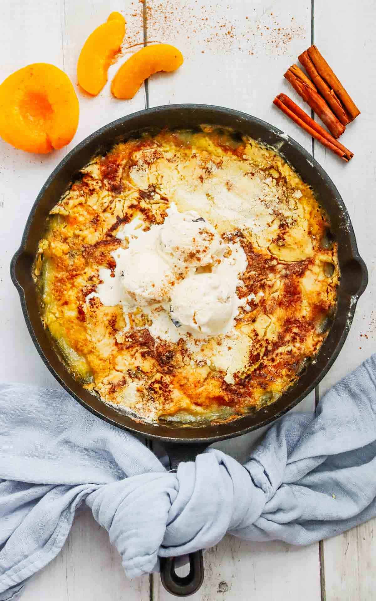 This Skillet Peach Dump Cake is the ultimate easy dessert recipe for peach lovers. Made with canned peaches or fresh peaches, yellow cake mix, butter, and cinnamon, this Peach Dump Cake Recipe comes together with minimal prep and bakes to golden perfection in a cast iron skillet. If you're searching for Easy Peach Desserts, Peach Dessert Recipes, Dump Cake Recipes, Peach Cobbler Dump Cake, Cast Iron Skillet Desserts, Summer Peach Recipes, Fresh Peach Desserts, or Quick Family Desserts, this recipe is a must-try. Perfect for potlucks, BBQs, holidays, weeknight treats, and summer gatherings, this warm and buttery dessert tastes amazing topped with vanilla ice cream or whipped cream. Save this Easy Peach Dump Cake for your next simple homemade dessert.