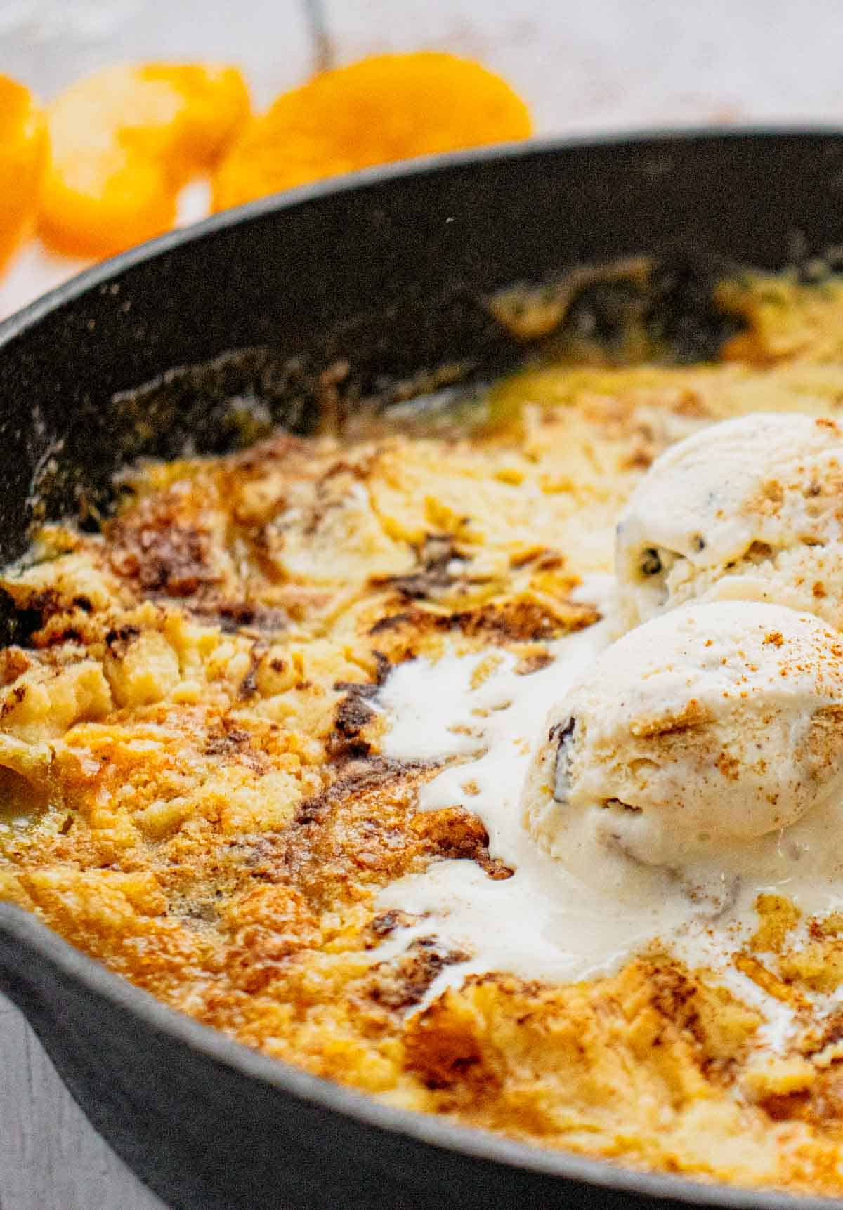 This Skillet Peach Dump Cake is the ultimate easy dessert recipe for peach lovers. Made with canned peaches or fresh peaches, yellow cake mix, butter, and cinnamon, this Peach Dump Cake Recipe comes together with minimal prep and bakes to golden perfection in a cast iron skillet. If you're searching for Easy Peach Desserts, Peach Dessert Recipes, Dump Cake Recipes, Peach Cobbler Dump Cake, Cast Iron Skillet Desserts, Summer Peach Recipes, Fresh Peach Desserts, or Quick Family Desserts, this recipe is a must-try. Perfect for potlucks, BBQs, holidays, weeknight treats, and summer gatherings, this warm and buttery dessert tastes amazing topped with vanilla ice cream or whipped cream. Save this Easy Peach Dump Cake for your next simple homemade dessert.