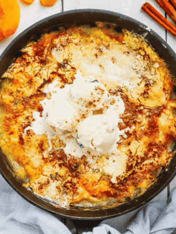 This Skillet Peach Dump Cake is the ultimate easy dessert recipe for peach lovers. Made with canned peaches or fresh peaches, yellow cake mix, butter, and cinnamon, this Peach Dump Cake Recipe comes together with minimal prep and bakes to golden perfection in a cast iron skillet. If you're searching for Easy Peach Desserts, Peach Dessert Recipes, Dump Cake Recipes, Peach Cobbler Dump Cake, Cast Iron Skillet Desserts, Summer Peach Recipes, Fresh Peach Desserts, or Quick Family Desserts, this recipe is a must-try. Perfect for potlucks, BBQs, holidays, weeknight treats, and summer gatherings, this warm and buttery dessert tastes amazing topped with vanilla ice cream or whipped cream. Save this Easy Peach Dump Cake for your next simple homemade dessert.