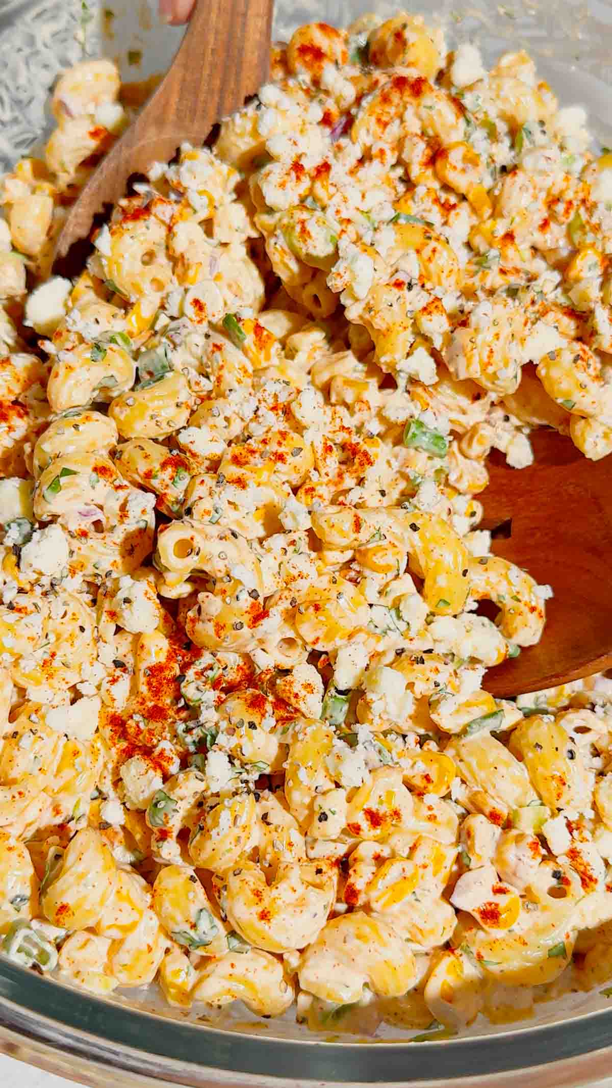 This Street Corn Pasta Salad is the ultimate Summer Pasta Salad for BBQs, potlucks, cookouts, and family gatherings. Made with tender cavatappi pasta, roasted corn, cotija cheese, red onion, green onions, fresh cilantro, and a creamy lime dressing, this Mexican Street Corn Pasta Salad is packed with bold flavor in every bite. If you're searching for Easy Pasta Salad Recipes, Corn Pasta Salad, Mexican Pasta Salad, Cold Pasta Salad Recipes, or Summer Side Dishes, this recipe is a must-try. Perfect for Backyard BBQ Food Ideas, Picnic Side Dishes, Potluck Recipes, and Make Ahead Salads, it comes together with simple ingredients and is always a crowd favorite. Serve this Street Corn Salad Recipe alongside grilled chicken, burgers, steak, or tacos for an easy and delicious summer meal everyone will love.