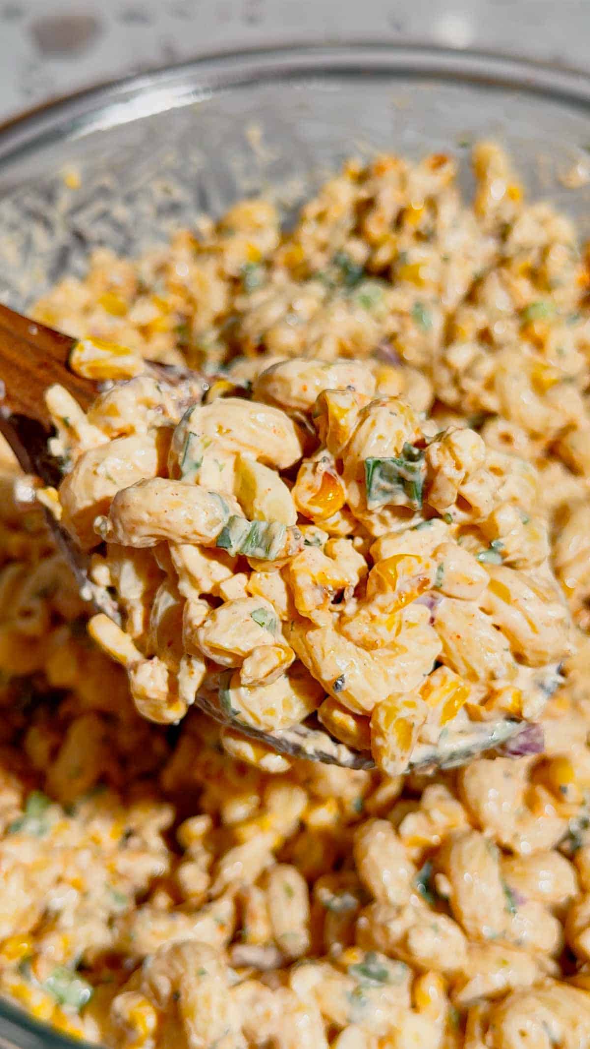 This Street Corn Pasta Salad is the ultimate Summer Pasta Salad for BBQs, potlucks, cookouts, and family gatherings. Made with tender cavatappi pasta, roasted corn, cotija cheese, red onion, green onions, fresh cilantro, and a creamy lime dressing, this Mexican Street Corn Pasta Salad is packed with bold flavor in every bite. If you're searching for Easy Pasta Salad Recipes, Corn Pasta Salad, Mexican Pasta Salad, Cold Pasta Salad Recipes, or Summer Side Dishes, this recipe is a must-try. Perfect for Backyard BBQ Food Ideas, Picnic Side Dishes, Potluck Recipes, and Make Ahead Salads, it comes together with simple ingredients and is always a crowd favorite. Serve this Street Corn Salad Recipe alongside grilled chicken, burgers, steak, or tacos for an easy and delicious summer meal everyone will love.