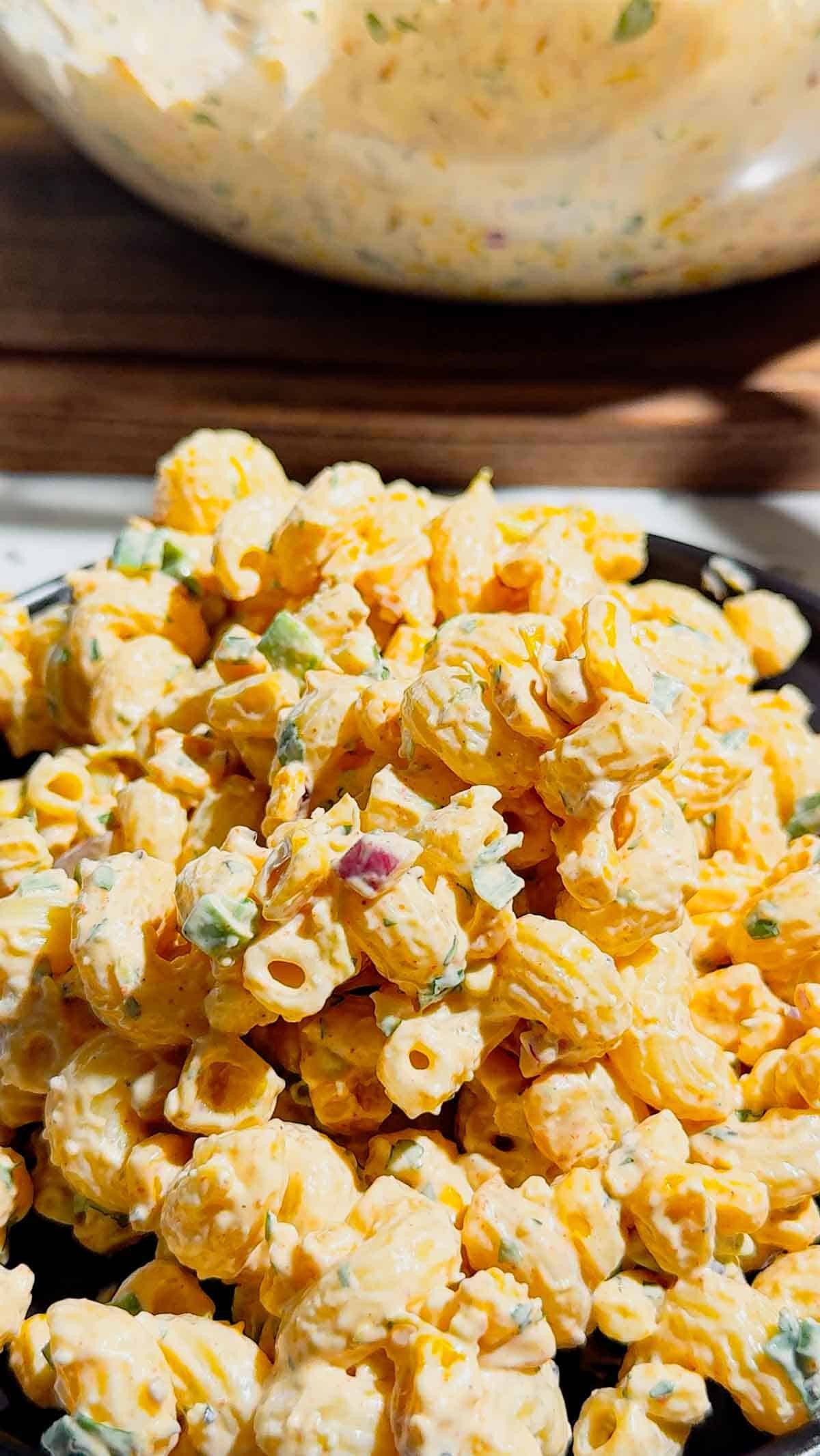 This Street Corn Pasta Salad is the ultimate Summer Pasta Salad for BBQs, potlucks, cookouts, and family gatherings. Made with tender cavatappi pasta, roasted corn, cotija cheese, red onion, green onions, fresh cilantro, and a creamy lime dressing, this Mexican Street Corn Pasta Salad is packed with bold flavor in every bite. If you're searching for Easy Pasta Salad Recipes, Corn Pasta Salad, Mexican Pasta Salad, Cold Pasta Salad Recipes, or Summer Side Dishes, this recipe is a must-try. Perfect for Backyard BBQ Food Ideas, Picnic Side Dishes, Potluck Recipes, and Make Ahead Salads, it comes together with simple ingredients and is always a crowd favorite. Serve this Street Corn Salad Recipe alongside grilled chicken, burgers, steak, or tacos for an easy and delicious summer meal everyone will love.