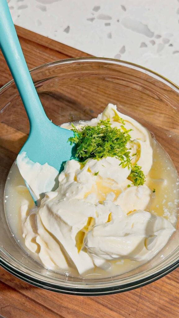 lime zest, lime juice, sour cream and mayo in glass mixing bowl