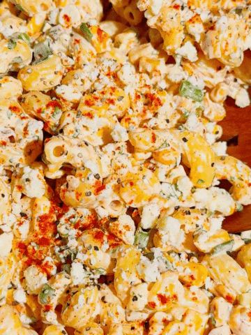 This Street Corn Pasta Salad is the ultimate Summer Pasta Salad for BBQs, potlucks, cookouts, and family gatherings. Made with tender cavatappi pasta, roasted corn, cotija cheese, red onion, green onions, fresh cilantro, and a creamy lime dressing, this Mexican Street Corn Pasta Salad is packed with bold flavor in every bite. If you're searching for Easy Pasta Salad Recipes, Corn Pasta Salad, Mexican Pasta Salad, Cold Pasta Salad Recipes, or Summer Side Dishes, this recipe is a must-try. Perfect for Backyard BBQ Food Ideas, Picnic Side Dishes, Potluck Recipes, and Make Ahead Salads, it comes together with simple ingredients and is always a crowd favorite. Serve this Street Corn Salad Recipe alongside grilled chicken, burgers, steak, or tacos for an easy and delicious summer meal everyone will love.