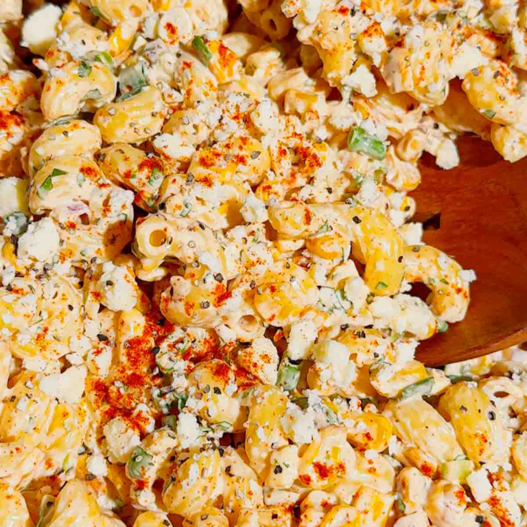 This Street Corn Pasta Salad is the ultimate Summer Pasta Salad for BBQs, potlucks, cookouts, and family gatherings. Made with tender cavatappi pasta, roasted corn, cotija cheese, red onion, green onions, fresh cilantro, and a creamy lime dressing, this Mexican Street Corn Pasta Salad is packed with bold flavor in every bite. If you're searching for Easy Pasta Salad Recipes, Corn Pasta Salad, Mexican Pasta Salad, Cold Pasta Salad Recipes, or Summer Side Dishes, this recipe is a must-try. Perfect for Backyard BBQ Food Ideas, Picnic Side Dishes, Potluck Recipes, and Make Ahead Salads, it comes together with simple ingredients and is always a crowd favorite. Serve this Street Corn Salad Recipe alongside grilled chicken, burgers, steak, or tacos for an easy and delicious summer meal everyone will love.