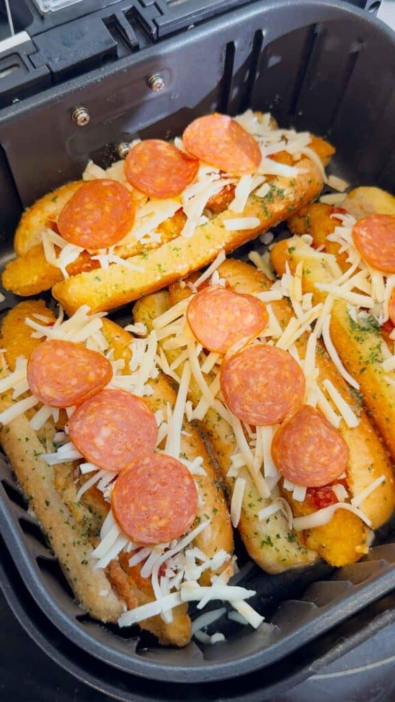 pepperoni and cheese on top of crispy chicken subs