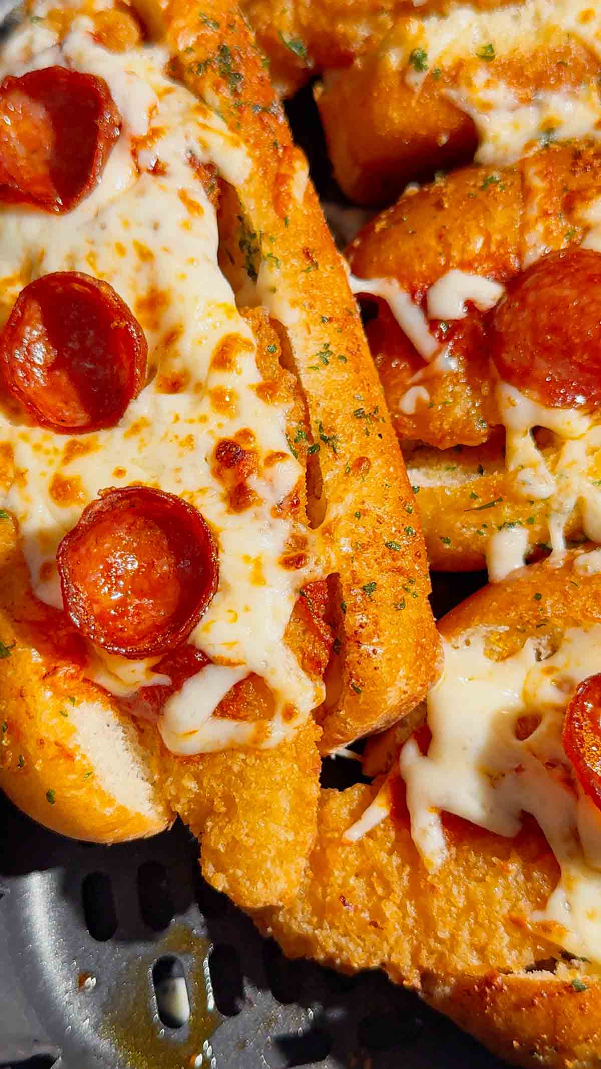 Looking for an easy air fryer dinner everyone will devour? These Air Fryer Crispy Chicken Pizza Subs combine crispy chicken tenders, pepperoni, pizza sauce, gooey mozzarella, and buttery garlic buns for the ultimate handheld meal. Perfect for air fryer recipes, easy weeknight dinners, kid friendly dinners, pizza sandwiches, chicken sub recipes, hot dog bun recipes, quick family meals, game day food, easy lunch ideas, and comfort food recipes. This simple recipe uses frozen chicken tenders for a fast dinner that's packed with pizza flavor and ready in minutes. Save this easy air fryer recipe for busy nights, party food, after-school meals, or whenever you're craving a cheesy, crispy pizza-inspired sandwich the whole family will love!