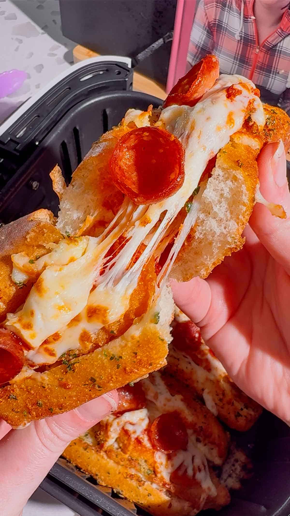 Looking for an easy air fryer dinner everyone will devour? These Air Fryer Crispy Chicken Pizza Subs combine crispy chicken tenders, pepperoni, pizza sauce, gooey mozzarella, and buttery garlic buns for the ultimate handheld meal. Perfect for air fryer recipes, easy weeknight dinners, kid friendly dinners, pizza sandwiches, chicken sub recipes, hot dog bun recipes, quick family meals, game day food, easy lunch ideas, and comfort food recipes. This simple recipe uses frozen chicken tenders for a fast dinner that's packed with pizza flavor and ready in minutes. Save this easy air fryer recipe for busy nights, party food, after-school meals, or whenever you're craving a cheesy, crispy pizza-inspired sandwich the whole family will love!