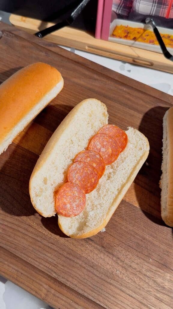 pepperoni slices inside a hot dog bun
