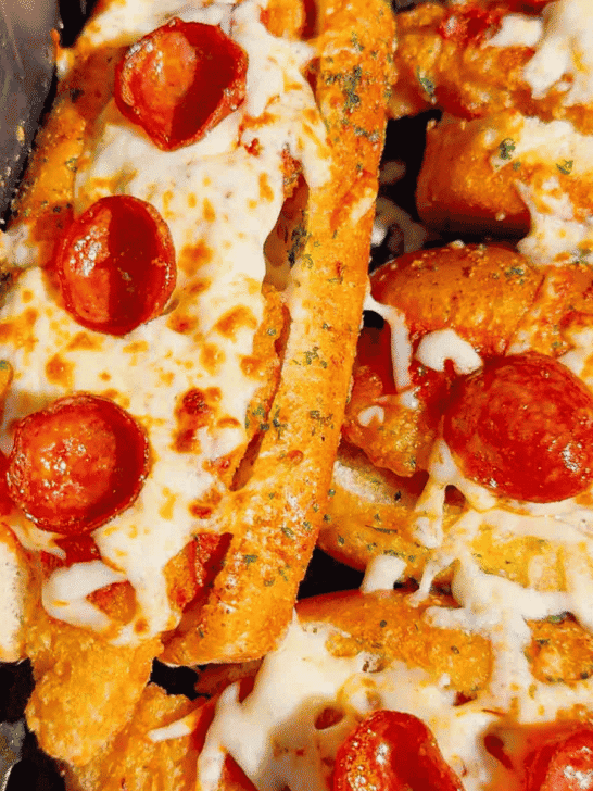 Looking for an easy air fryer dinner everyone will devour? These Air Fryer Crispy Chicken Pizza Subs combine crispy chicken tenders, pepperoni, pizza sauce, gooey mozzarella, and buttery garlic buns for the ultimate handheld meal. Perfect for air fryer recipes, easy weeknight dinners, kid friendly dinners, pizza sandwiches, chicken sub recipes, hot dog bun recipes, quick family meals, game day food, easy lunch ideas, and comfort food recipes. This simple recipe uses frozen chicken tenders for a fast dinner that's packed with pizza flavor and ready in minutes. Save this easy air fryer recipe for busy nights, party food, after-school meals, or whenever you're craving a cheesy, crispy pizza-inspired sandwich the whole family will love!