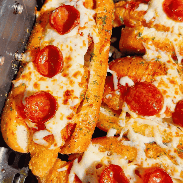 Looking for an easy air fryer dinner everyone will devour? These Air Fryer Crispy Chicken Pizza Subs combine crispy chicken tenders, pepperoni, pizza sauce, gooey mozzarella, and buttery garlic buns for the ultimate handheld meal. Perfect for air fryer recipes, easy weeknight dinners, kid friendly dinners, pizza sandwiches, chicken sub recipes, hot dog bun recipes, quick family meals, game day food, easy lunch ideas, and comfort food recipes. This simple recipe uses frozen chicken tenders for a fast dinner that's packed with pizza flavor and ready in minutes. Save this easy air fryer recipe for busy nights, party food, after-school meals, or whenever you're craving a cheesy, crispy pizza-inspired sandwich the whole family will love!