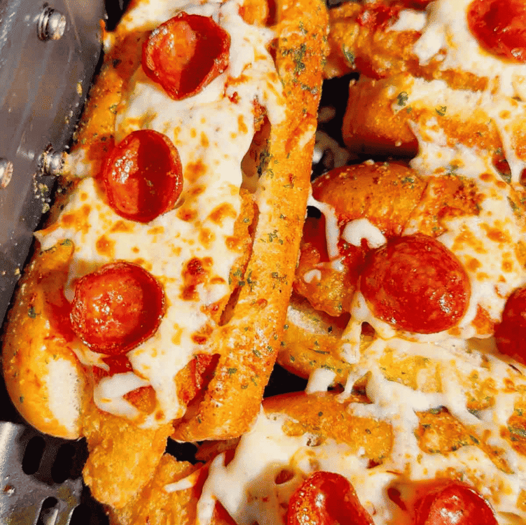 Looking for an easy air fryer dinner everyone will devour? These Air Fryer Crispy Chicken Pizza Subs combine crispy chicken tenders, pepperoni, pizza sauce, gooey mozzarella, and buttery garlic buns for the ultimate handheld meal. Perfect for air fryer recipes, easy weeknight dinners, kid friendly dinners, pizza sandwiches, chicken sub recipes, hot dog bun recipes, quick family meals, game day food, easy lunch ideas, and comfort food recipes. This simple recipe uses frozen chicken tenders for a fast dinner that's packed with pizza flavor and ready in minutes. Save this easy air fryer recipe for busy nights, party food, after-school meals, or whenever you're craving a cheesy, crispy pizza-inspired sandwich the whole family will love!