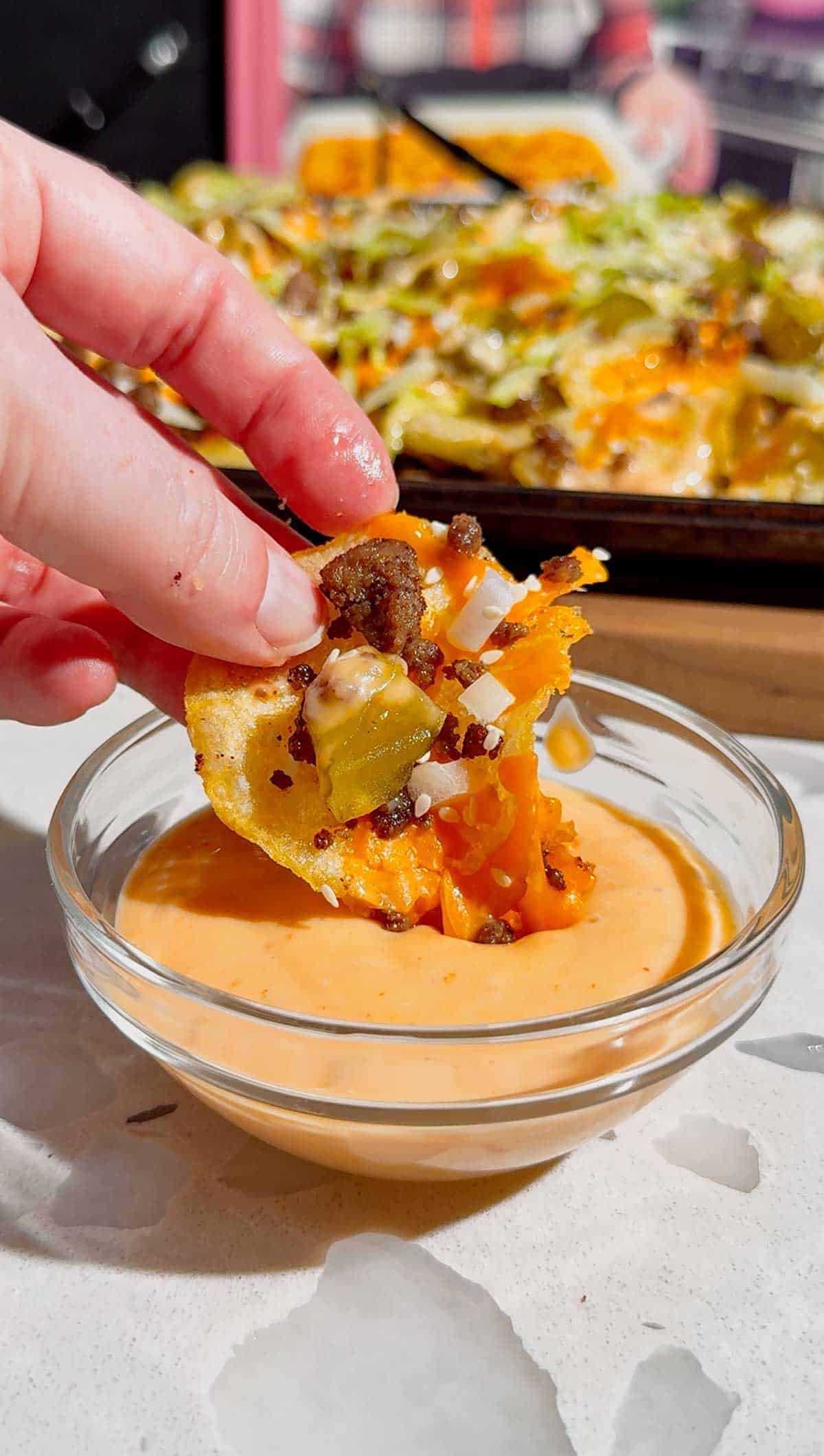 Looking for the ultimate game day snack or easy party appetizer? These Big Mac Nachos combine all the iconic flavors of your favorite cheeseburger with crispy kettle cooked potato chips for an unforgettable crowd-pleasing recipe. Loaded with seasoned ground beef, melted cheddar cheese, pickles, onions, shredded lettuce, Thousand Island dressing, and sesame seeds, these cheeseburger nachos are perfect for football parties, tailgates, family movie nights, and quick weeknight dinners. If you love loaded nachos, burger recipes, Big Mac-inspired recipes, easy appetizers, sheet pan snacks, comfort food, and fun party food ideas, this simple recipe belongs on your menu. Save this easy Big Mac Nachos recipe for your next game day spread, potluck, or casual family gathering!