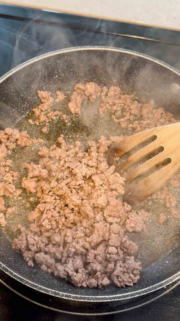 cooked ground beef in a skillet