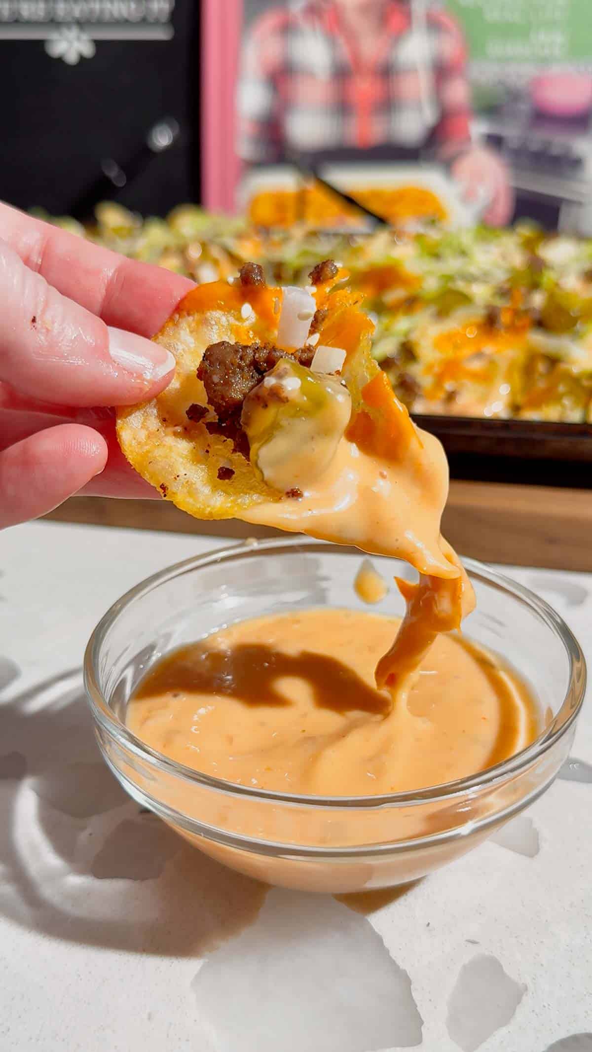 Looking for the ultimate game day snack or easy party appetizer? These Big Mac Nachos combine all the iconic flavors of your favorite cheeseburger with crispy kettle cooked potato chips for an unforgettable crowd-pleasing recipe. Loaded with seasoned ground beef, melted cheddar cheese, pickles, onions, shredded lettuce, Thousand Island dressing, and sesame seeds, these cheeseburger nachos are perfect for football parties, tailgates, family movie nights, and quick weeknight dinners. If you love loaded nachos, burger recipes, Big Mac-inspired recipes, easy appetizers, sheet pan snacks, comfort food, and fun party food ideas, this simple recipe belongs on your menu. Save this easy Big Mac Nachos recipe for your next game day spread, potluck, or casual family gathering!