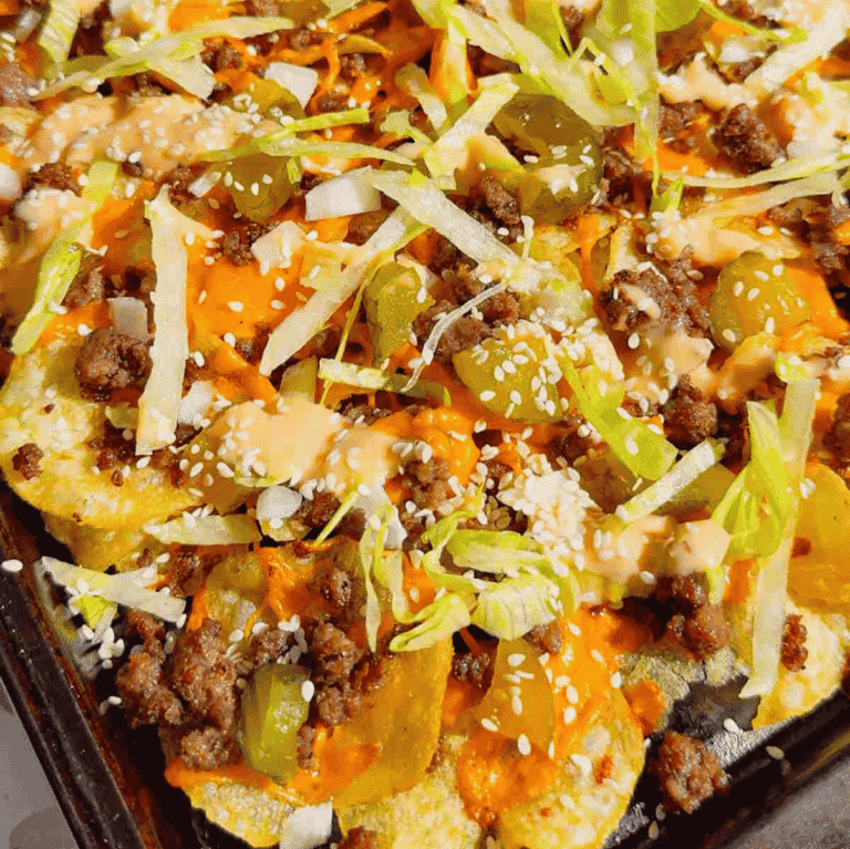 Looking for the ultimate game day snack or easy party appetizer? These Big Mac Nachos combine all the iconic flavors of your favorite cheeseburger with crispy kettle cooked potato chips for an unforgettable crowd-pleasing recipe. Loaded with seasoned ground beef, melted cheddar cheese, pickles, onions, shredded lettuce, Thousand Island dressing, and sesame seeds, these cheeseburger nachos are perfect for football parties, tailgates, family movie nights, and quick weeknight dinners. If you love loaded nachos, burger recipes, Big Mac-inspired recipes, easy appetizers, sheet pan snacks, comfort food, and fun party food ideas, this simple recipe belongs on your menu. Save this easy Big Mac Nachos recipe for your next game day spread, potluck, or casual family gathering!