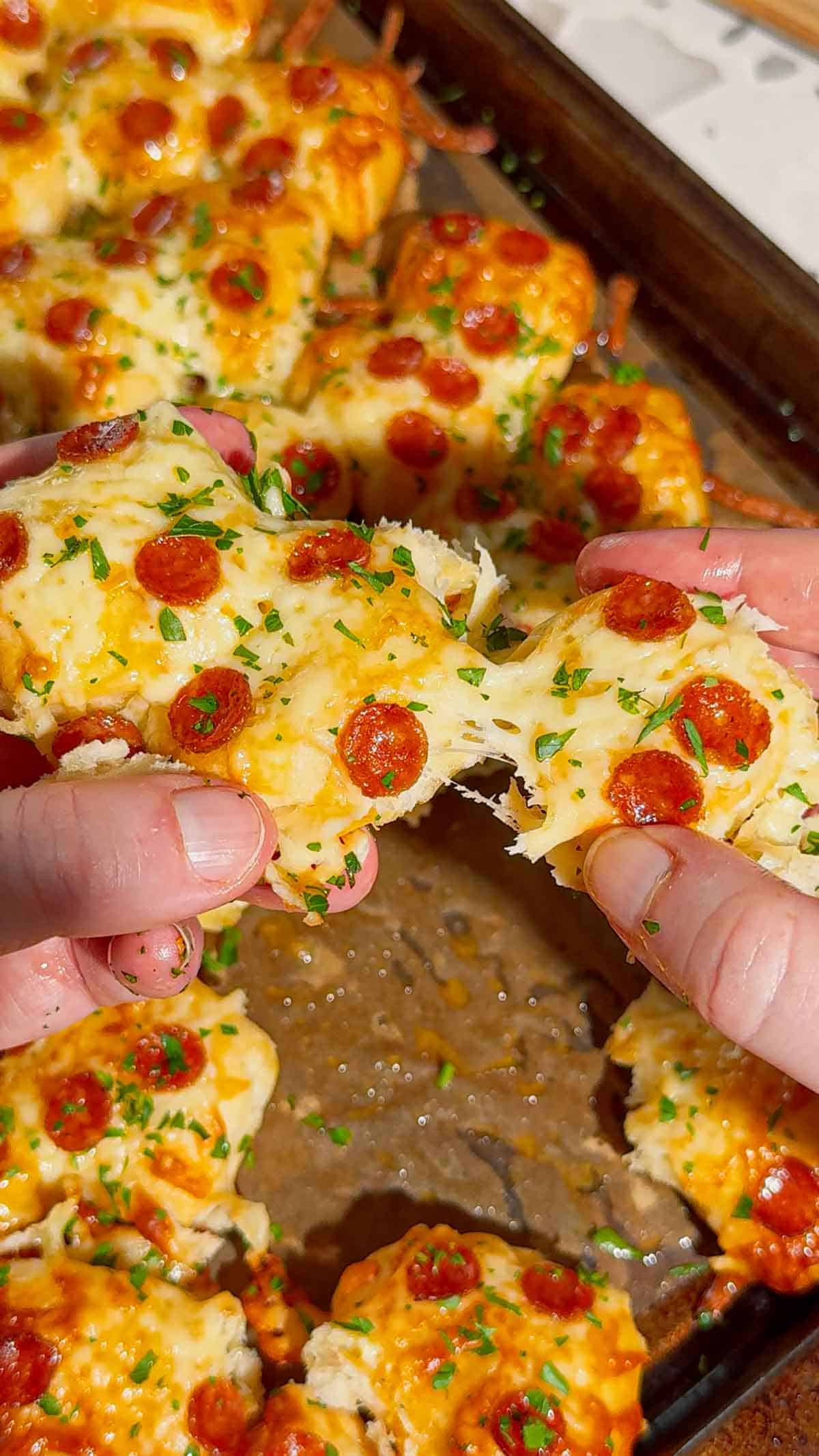 Looking for an easy pizza appetizer everyone will love? These Biscuit Pizza Bites are the perfect bite-sized snack made with refrigerated biscuit dough, mozzarella cheese, mini pepperoni, garlic butter, and fresh parsley. They're crispy, cheesy, buttery, and ready in under 30 minutes, making them ideal for easy appetizer recipes, game day snacks, party food ideas, after school snacks, quick dinner ideas, kid friendly meals, and finger food recipes. Serve them with pizza sauce, ranch, or garlic dipping sauce for the ultimate crowd-pleasing treat. Whether you're planning a family movie night, holiday party, football gathering, or need a simple weeknight recipe, these homemade pizza bites are guaranteed to disappear fast. Save this easy pizza snack recipe for your next party, potluck, or busy weeknight dinner!