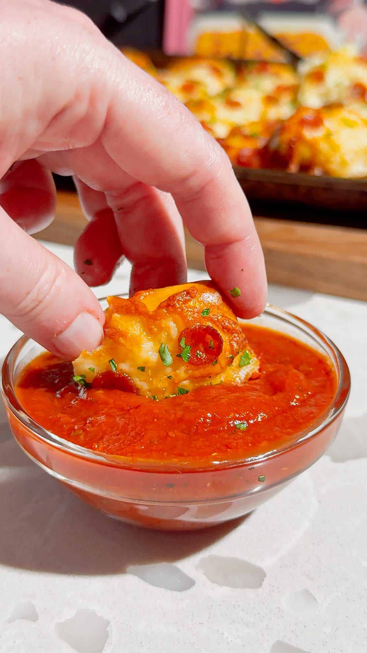 Looking for an easy pizza appetizer everyone will love? These Biscuit Pizza Bites are the perfect bite-sized snack made with refrigerated biscuit dough, mozzarella cheese, mini pepperoni, garlic butter, and fresh parsley. They're crispy, cheesy, buttery, and ready in under 30 minutes, making them ideal for easy appetizer recipes, game day snacks, party food ideas, after school snacks, quick dinner ideas, kid friendly meals, and finger food recipes. Serve them with pizza sauce, ranch, or garlic dipping sauce for the ultimate crowd-pleasing treat. Whether you're planning a family movie night, holiday party, football gathering, or need a simple weeknight recipe, these homemade pizza bites are guaranteed to disappear fast. Save this easy pizza snack recipe for your next party, potluck, or busy weeknight dinner!