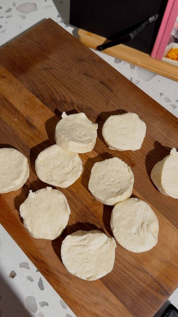 refrigerated biscuits on a cutting board