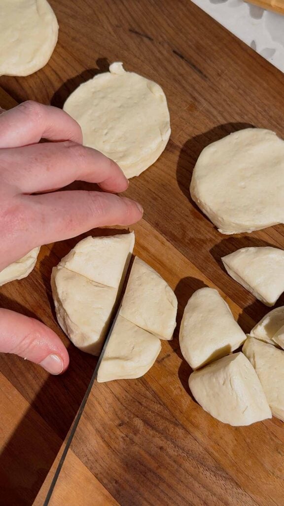 slicing pillsbury biscuits into quarters