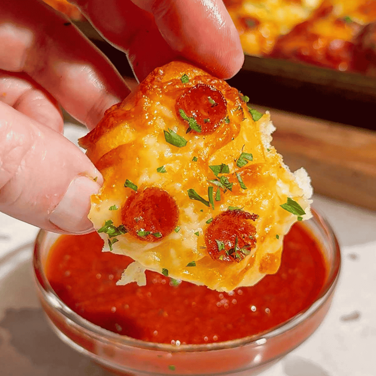 Looking for an easy pizza appetizer everyone will love? These Biscuit Pizza Bites are the perfect bite-sized snack made with refrigerated biscuit dough, mozzarella cheese, mini pepperoni, garlic butter, and fresh parsley. They're crispy, cheesy, buttery, and ready in under 30 minutes, making them ideal for easy appetizer recipes, game day snacks, party food ideas, after school snacks, quick dinner ideas, kid friendly meals, and finger food recipes. Serve them with pizza sauce, ranch, or garlic dipping sauce for the ultimate crowd-pleasing treat. Whether you're planning a family movie night, holiday party, football gathering, or need a simple weeknight recipe, these homemade pizza bites are guaranteed to disappear fast. Save this easy pizza snack recipe for your next party, potluck, or busy weeknight dinner!
