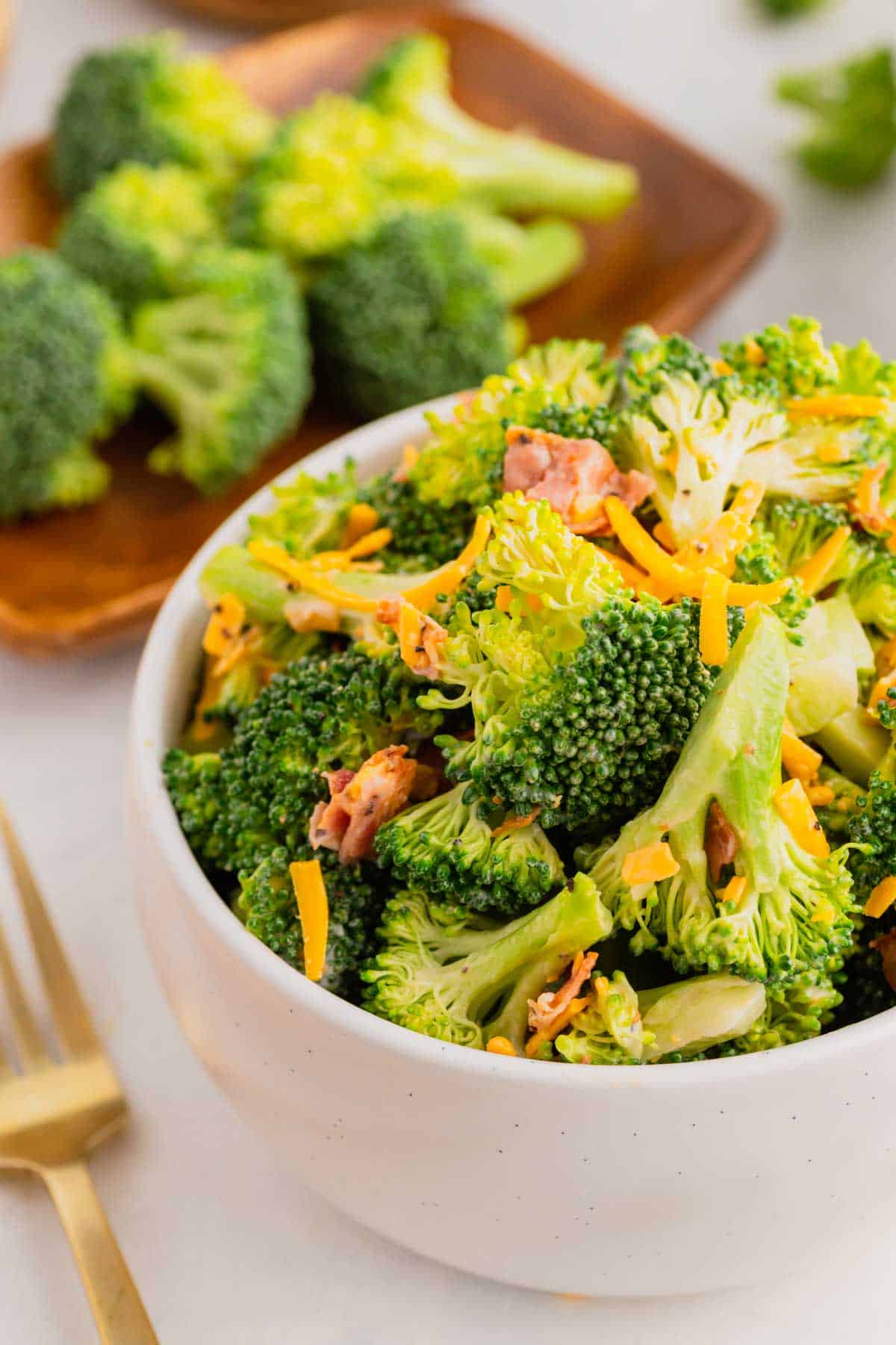Love the famous Chicken Salad Chick Broccoli Salad? This easy copycat recipe delivers the same crunchy, creamy, tangy flavor at home with fresh broccoli, sharp cheddar cheese, smoky bacon, mayonnaise, and red wine vinegar. Perfect for BBQs, potlucks, picnics, holiday gatherings, meal prep, and easy family dinners, this Broccoli Salad Recipe comes together in just 10 minutes and tastes even better after chilling. If you're searching for the best Copycat Chicken Salad Chick Broccoli Salad, Easy Broccoli Salad Recipe, Creamy Broccoli Salad With Bacon, Broccoli Salad With Cheddar Cheese, or a classic cold side dish everyone will love, this simple recipe is guaranteed to become a favorite all year long. Save this delicious broccoli salad for your next gathering!