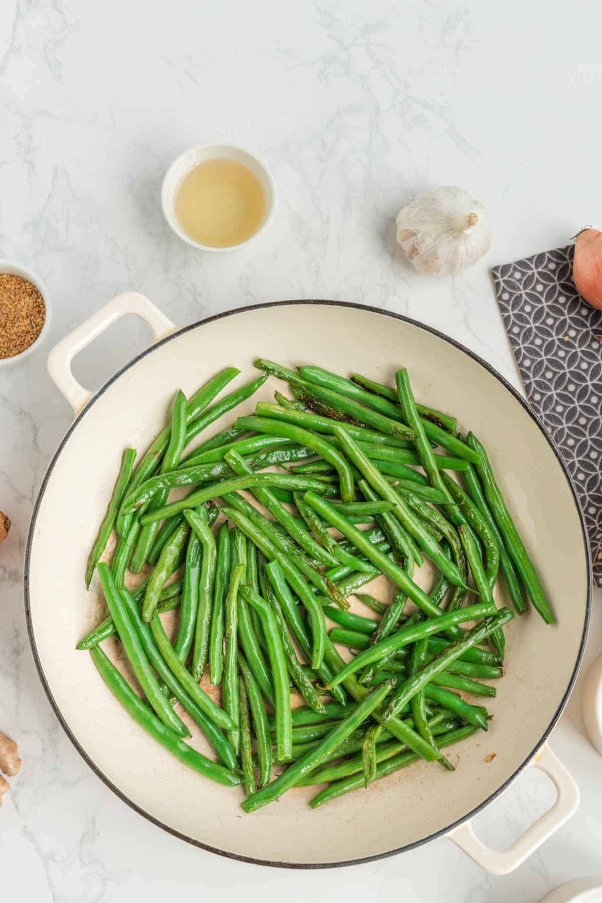 green beans cooking in a skillet