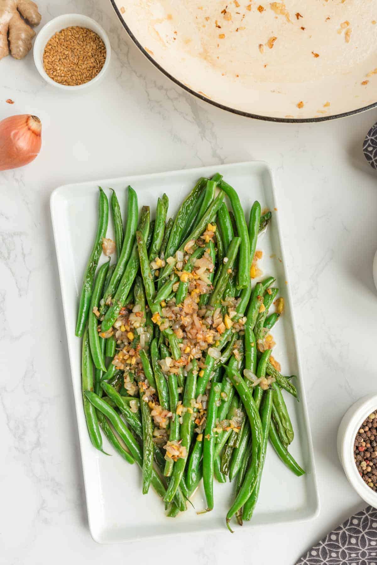 Looking for the best Chinese Green Beans recipe? These easy Asian Green Beans are crisp-tender, packed with garlic, ginger, shallots, and a savory touch of mirin for an irresistible restaurant-style side dish. If you've been searching for Chinese Green Bean Recipes, Garlic Green Beans, Stir Fry Green Beans, Green Bean Side Dish, Easy Vegetable Side Dishes, Healthy Green Bean Recipes, Asian Side Dishes, or How to Cook Fresh Green Beans, this simple recipe is a must-try. Perfect for busy weeknights, holiday dinners, or serving with your favorite chicken, beef, pork, or rice dishes, these flavorful sesame green beans come together in under 30 minutes and taste even better than takeout. Save this easy green bean recipe for your next family meal!
